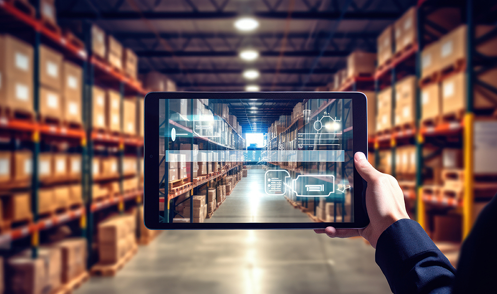 Warehouse with a person holding a tablet